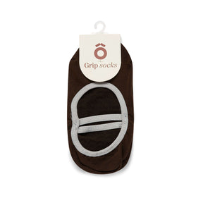 Brown grip sock with a white label on a white background