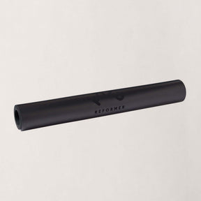 FOLD Essentials Reformer Pilates Mat - Black rolled up, showcasing durable black material for Pilates workouts.