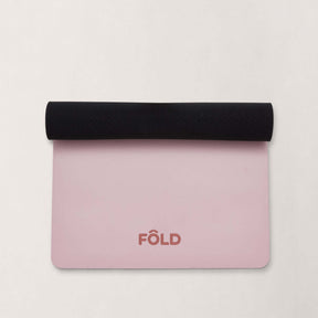 FOLD Reformer Pilates Mat - Pink with black rolled edge, perfect for comfortable pilates workouts.
