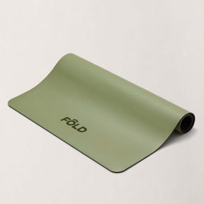 FOLD Reformer Pilates Mat - Pistachio in a soft green color, designed for comfortable workout cushioning.