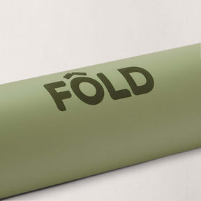 FOLD Reformer Pilates Mat - Pistachio with logo design on soft, durable surface for comfortable workouts.