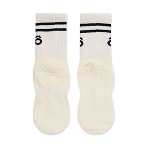 Pair of white socks with black stripes and logo on a white background