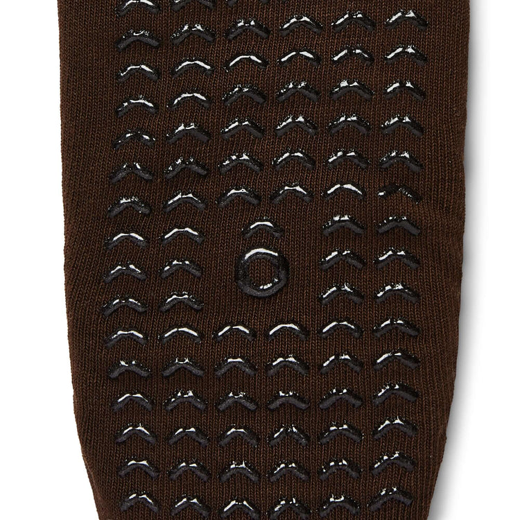 Brown sock with black textured pattern on a white background