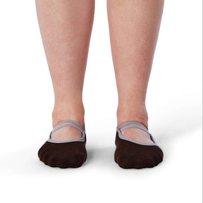 Brown socks with gray straps worn by a person on a white background