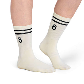 Crew Sporty Stripes Pilates Grip Socks - White worn on feet with black stripes and logo design.