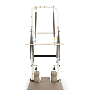 Tower pilates reformer machine on a white background
