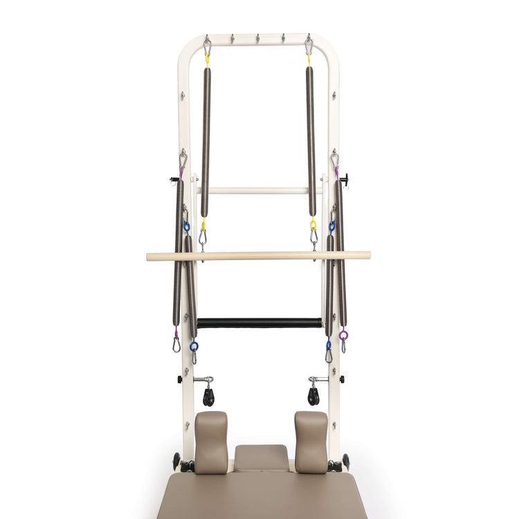 Tower pilates reformer machine on a white background
