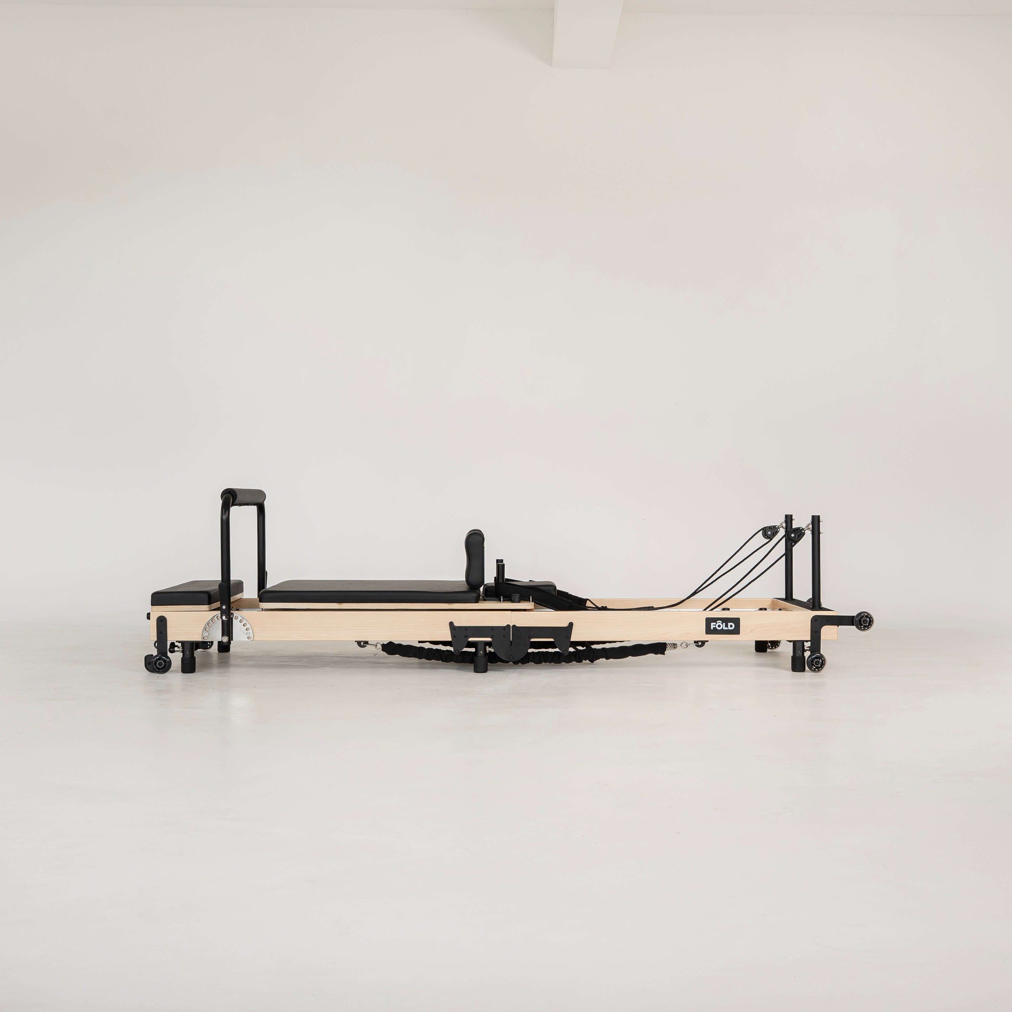 Pilates reformer on a white background