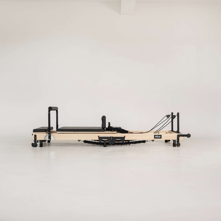 Pilates reformer on a white background
