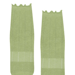 Two frilly green Pilates grip socks front view