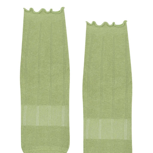 Two frilly green Pilates grip socks front view