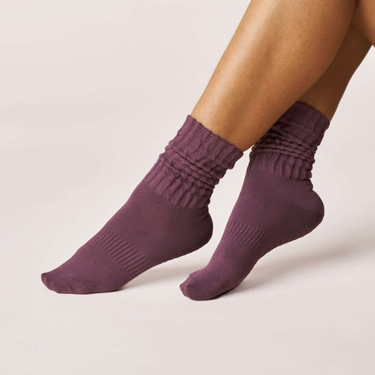 Pilates Scrunch Grip Socks - Magenta displayed on a model's feet showcasing the scrunch design and snug fit.